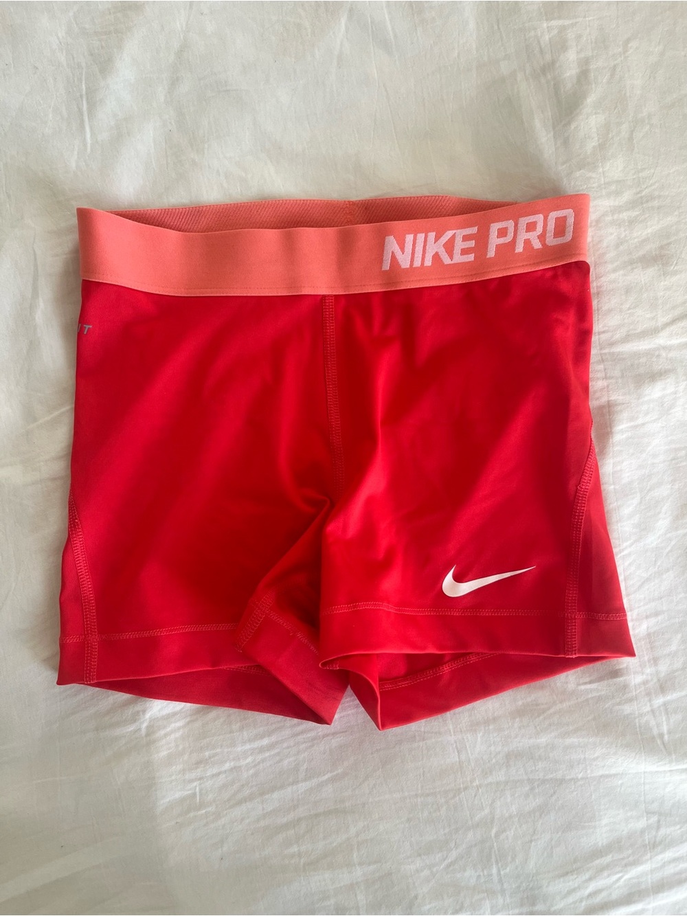 Nike Pro Women's Red Athletic Compression Shorts with Pink Waistband